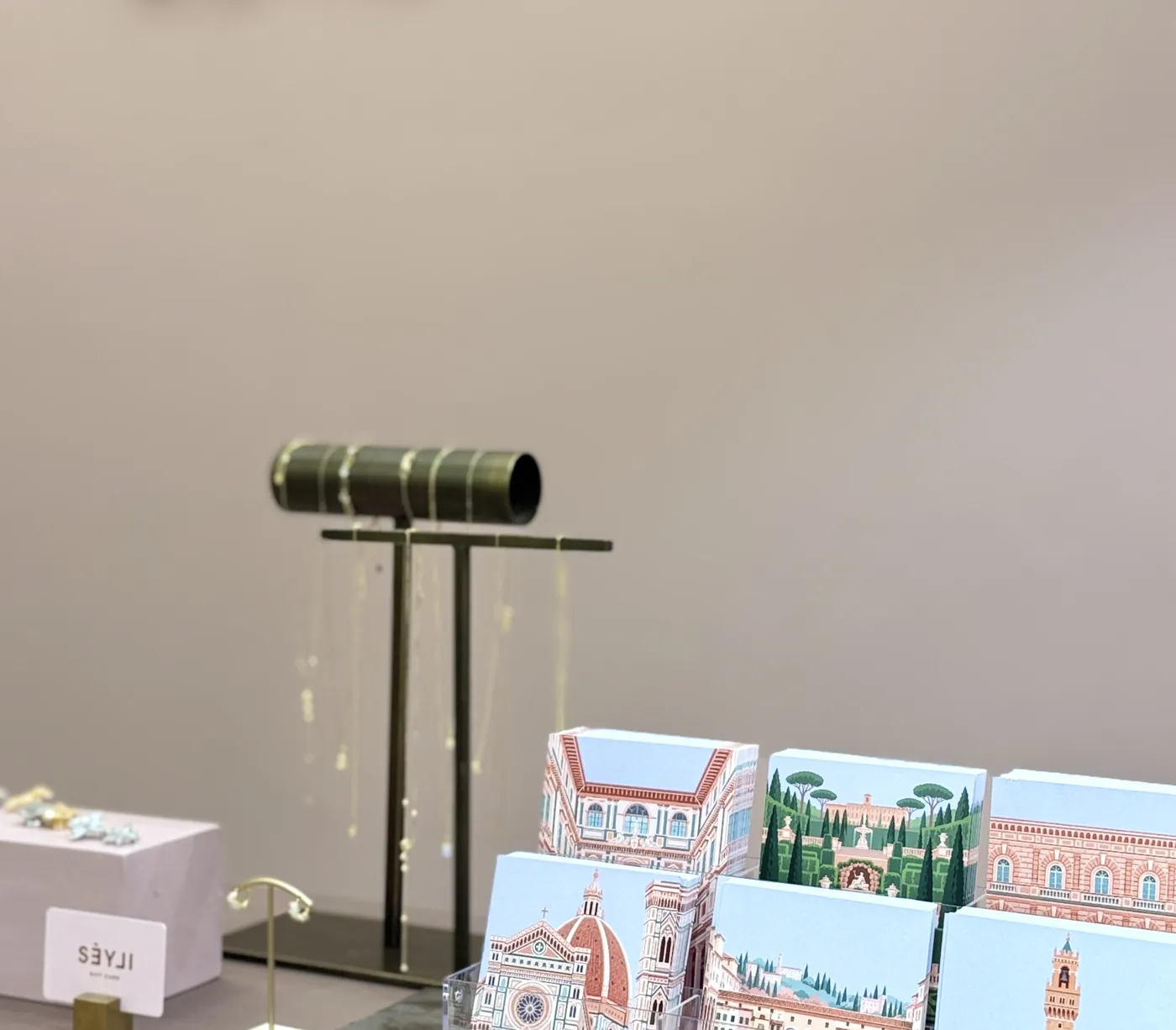 Florence postcard prints beside jewellery in the SÉYLI boutique